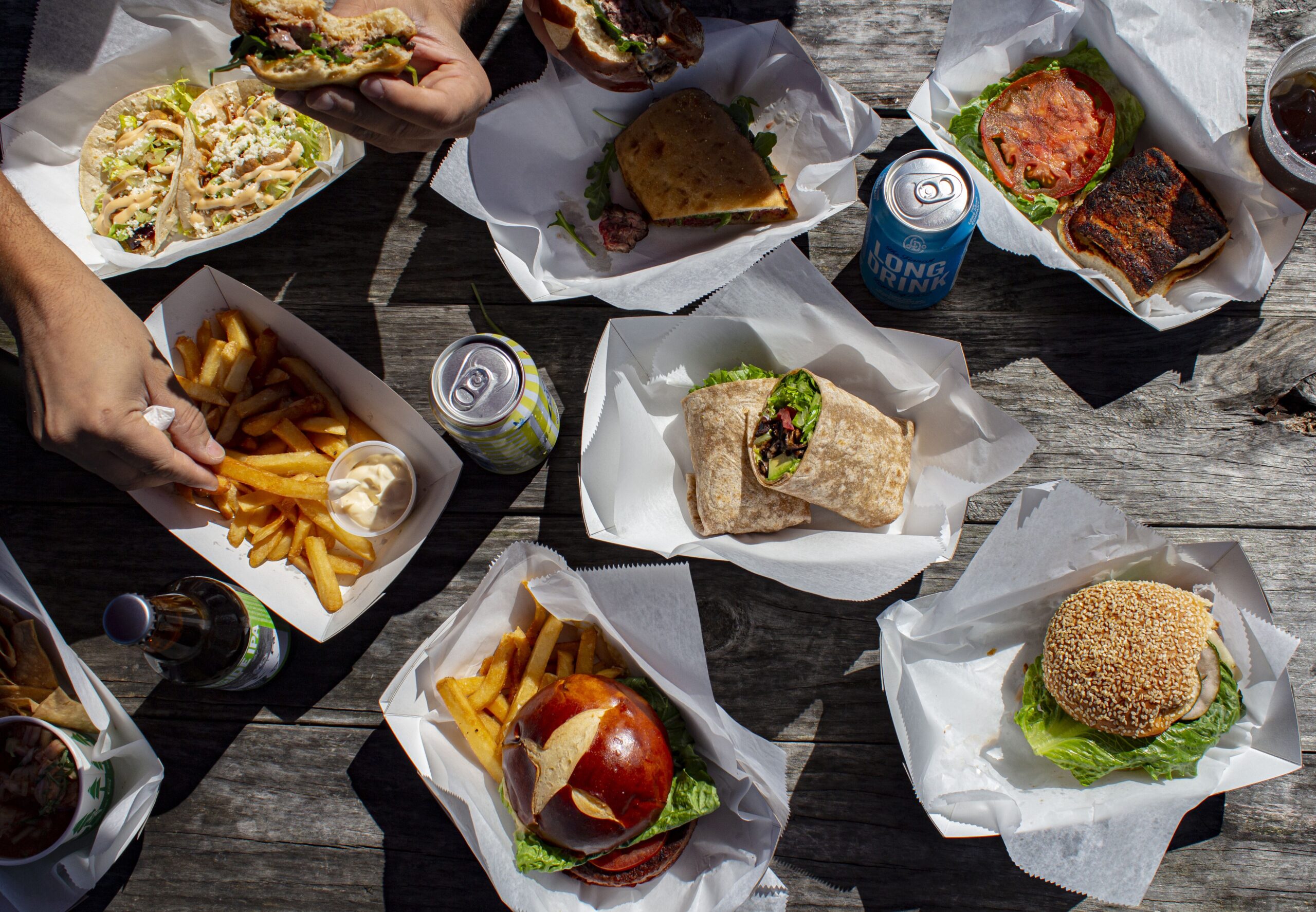 A farm-table spread of dishes and drinks at the North Fork Shack
